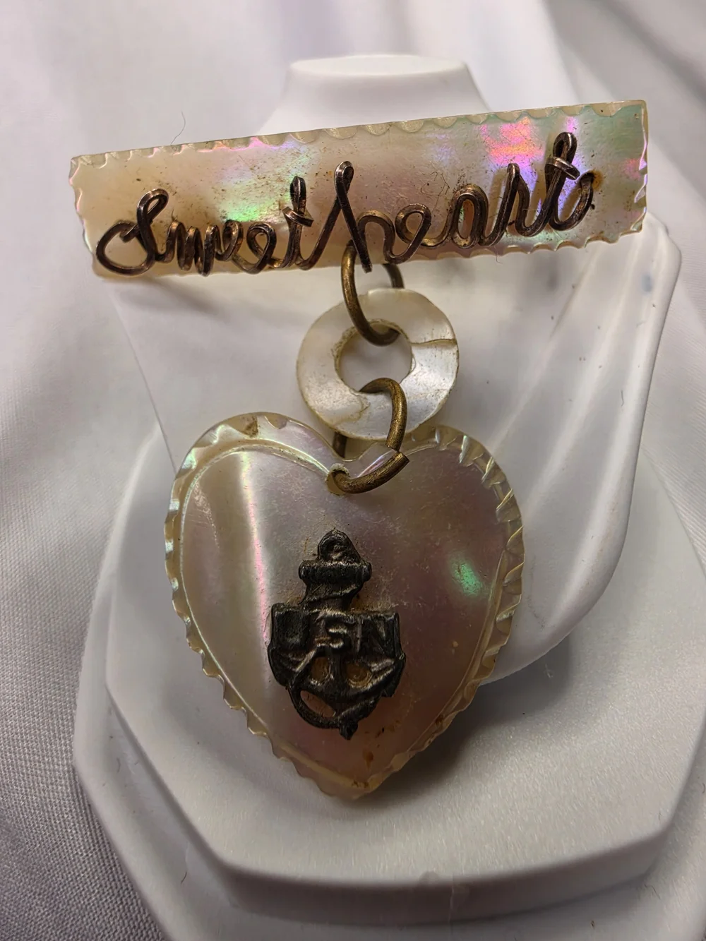 Vintage World War II-era U.S. Navy sweetheart brooch, made from carved MOP